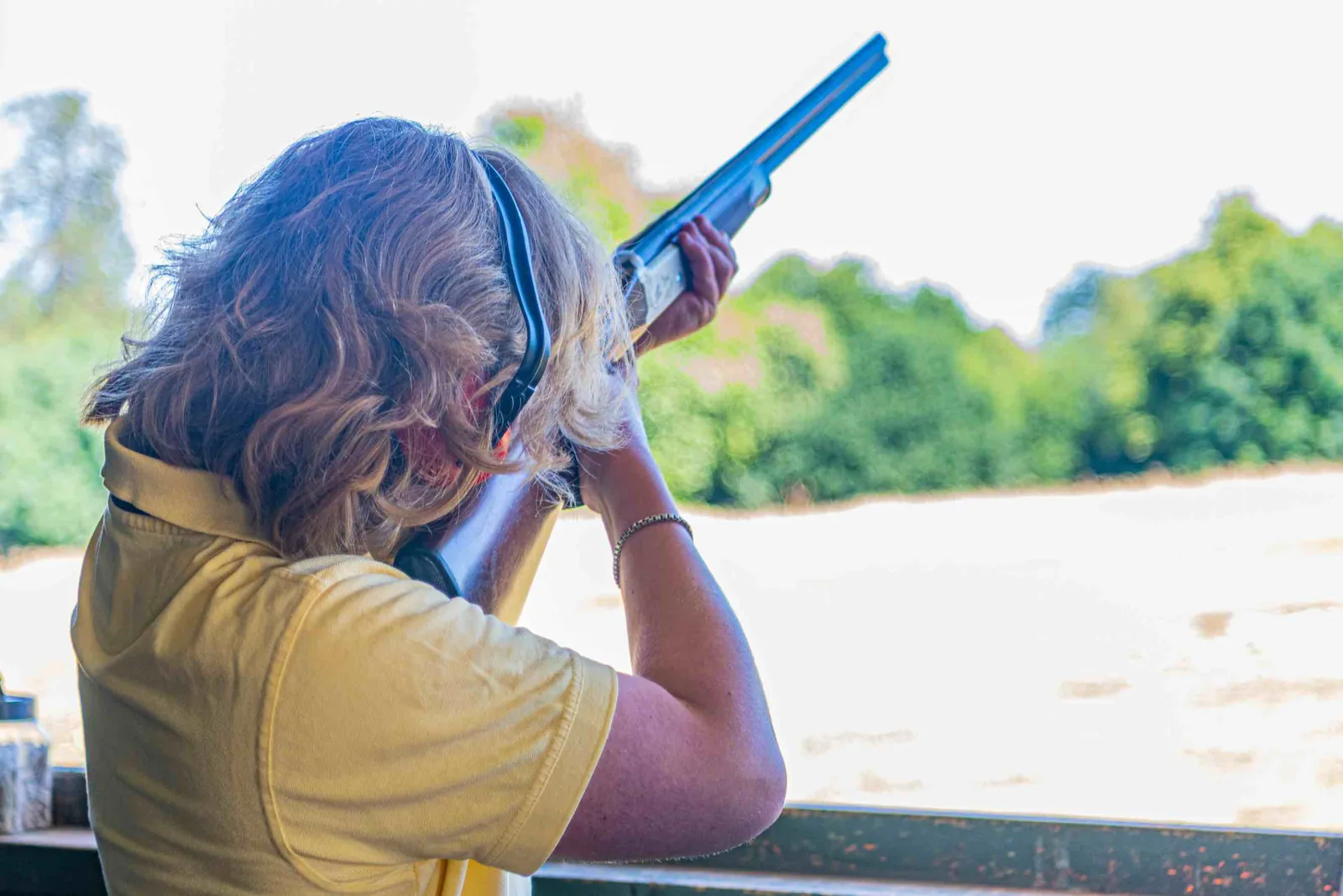 A guest taking aim at a flying clay from the shooting stand at Escot Park