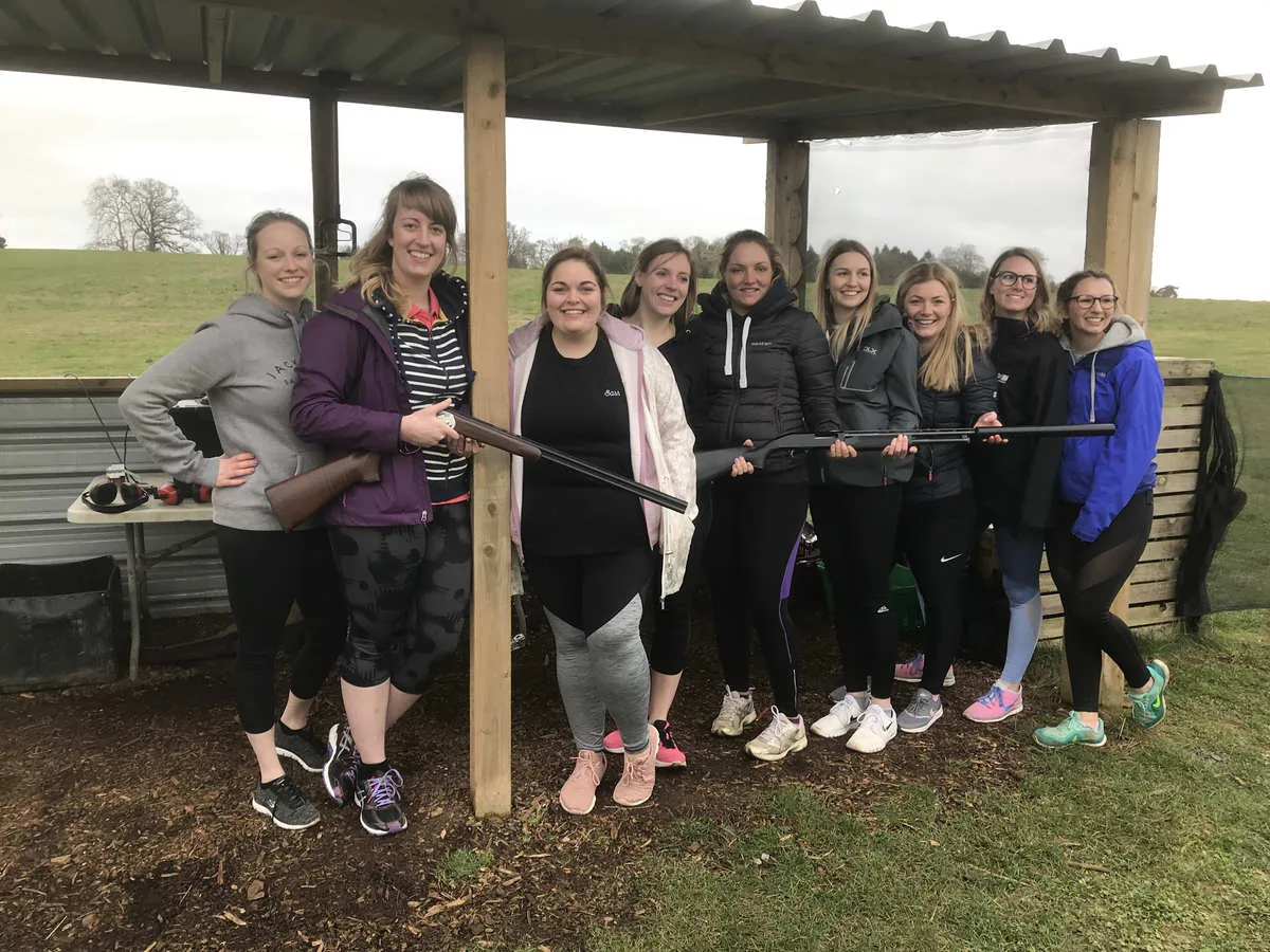 A group enjoying their clay shooting day at the Escot Park stands